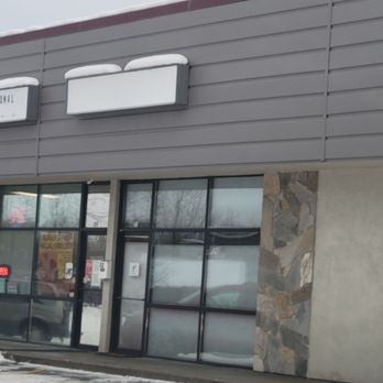 Alaska International Grocery -  a red car parked in front of the store - Halal Near Me - Anchorage, Alaska