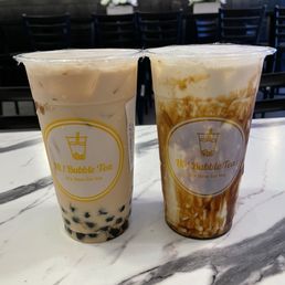 Classic milk tea with boba on left and brown sugar fresh milk on right. Classic milk tea with boba on left and brown sugar fresh milk on right.