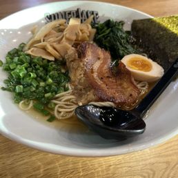 Shoyu ramen bowl Pork, seaweed, bamboo shoots, seasoned egg, green onions.