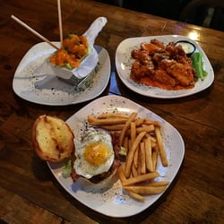 Top left: Dynamite Shrimp.
Top right: A dozen wings, "House" sauce.
Bottom center: "Hangover" burger with regular French fries.