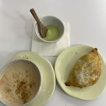 Over The Moon - Chai/oat milk -spinach empanada-green sauce! - Coffee & Tea Near Me - Queens, New York Over The Moon - Chai/oat milk -spinach empanada-green sauce! - Coffee & Tea Near Me - Queens, New York