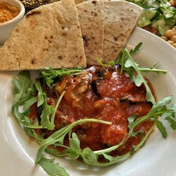 Missaka (eggplant in tangy garlic tomato sauce, served with bread and arugula) Missaka (eggplant in tangy garlic tomato sauce, served with bread and arugula)