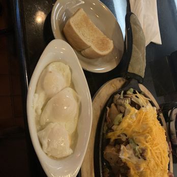 Buzz Inn Steakhouse - Tsunami Skillet, poached eggs, sourdough toast. The eggs came out perfect. - Steakhouses Near Me - Everett, Washington Buzz Inn Steakhouse - Tsunami Skillet, poached eggs, sourdough toast. The eggs came out perfect. - Steakhouses Near Me - Everett, Washington