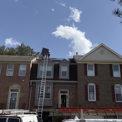 RNR Energy Solutions - Workers installing panel