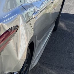 This is the original photo I uploaded of the accident for my claim, you can see there is no damage on the side skirt