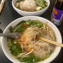 two bowls of soup with chopsticks two bowls of soup with chopsticks