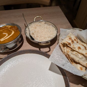 Namaste India Bistro - Butter chicken, basmati rice, and side of naan - Indian Near Me - Monterey, California Namaste India Bistro - Butter chicken, basmati rice, and side of naan - Indian Near Me - Monterey, California