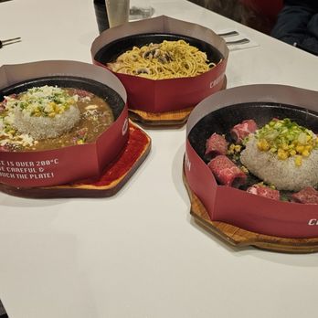 Flaming Kitchen - Top, Left, Right Black pepper chicken spaghetti, Black curry cheesy beef rice, Supreme beef rice - Asian Fusion Near Me - Scarborough, Ontario Flaming Kitchen - Top, Left, Right Black pepper chicken spaghetti, Black curry cheesy beef rice, Supreme beef rice - Asian Fusion Near Me - Scarborough, Ontario