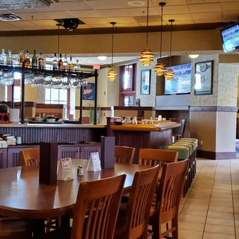 Minervas - a view of a dining area with a bar - American Near Me - Traverse City, Michigan Minervas - a view of a dining area with a bar - American Near Me - Traverse City, Michigan