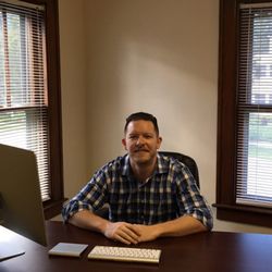 Alexander Parker, MD - Dr. Parker at his desk.