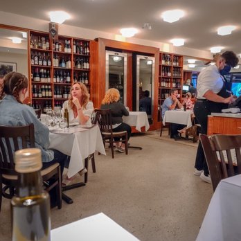 Bottega - people sitting at tables in a restaurant - Pizza Near Me - Montreal, Quebec