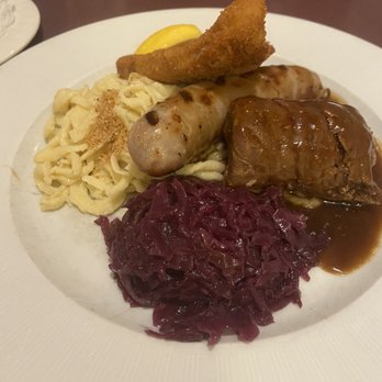 Waldhorn Restaurant - Waldhorn Sampler: Pork "Wienerschnitzel", Beef Roulade, and Bratwurst, served with homemade spätzle, red cabbage, and brown sauce - German Near Me - Pineville, North Carolina