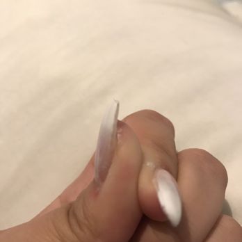 Nani Nails Salon - Hardened acrylic left under my thumb. The red area near my cuticle is where I was cut from filing. - Nail Salons Near Me - Honolulu, Hawaii
