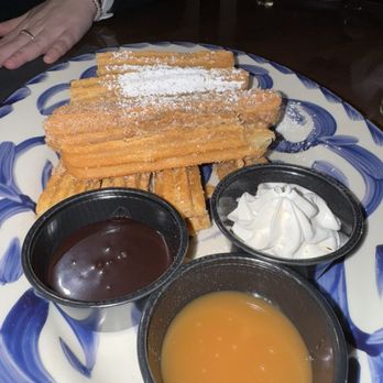 Dos Caminos - Churros with caramel, chocolate, and whipped cream - Mexican Near Me - Charlotte, North Carolina Dos Caminos - Churros with caramel, chocolate, and whipped cream - Mexican Near Me - Charlotte, North Carolina