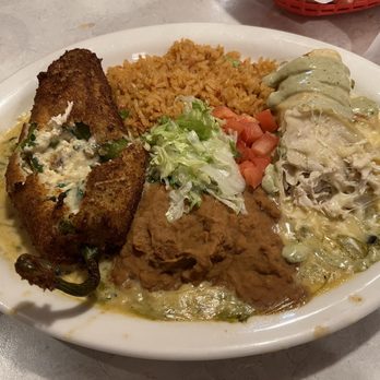 Chuy's - A side look at my meal with the chicken enchilada and chili relleno opened - this is a HUGE meal! - Tex-Mex Near Me - Jacksonville, Florida
