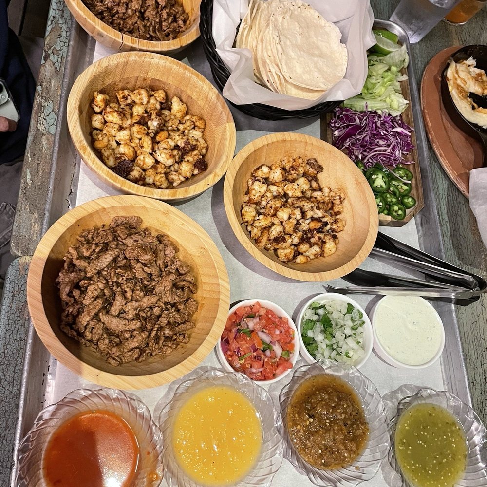 Buho tacos for six with two proteins (we chose shrimp and steak). Great flavors and hot flour tortillas Buho tacos for six with two proteins (we chose shrimp and steak). Great flavors and hot flour tortillas