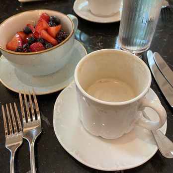 The George - a bowl of Yogurt and berrys, latte - New American Near Me - Seattle, Washington The George - a bowl of Yogurt and berrys, latte - New American Near Me - Seattle, Washington