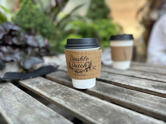 Photo of Double Dutch Espresso - New York, NY, US. a coffee cup on a wooden table