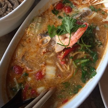 Nudi - Tom yum ramen: fresh ramen, prawn, sliced pork, onsen poached egg, enoki mushroom, bean sprouts, onion, cilantro, miso paste, tom yum broth - Asian Fusion Near Me - Portland, Oregon