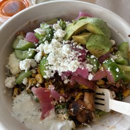 Kale, corn, cucumbers, spicy chicken, feta, avocado, pickled onions and tz sauce