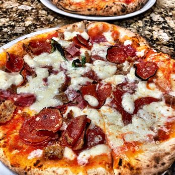 Antica Forma - Pizza:  Pepperoni, salami, Italian sausage (foreground); margarita (background) - Pizza Near Me - Moab, Utah