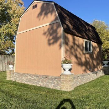 Precision Landscaping - the side of a building with a brown roof - Lawn Services Near Me Precision Landscaping - the side of a building with a brown roof - Lawn Services Near Me