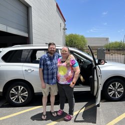 Centennial Leasing & Sales - Happy customers with their new car