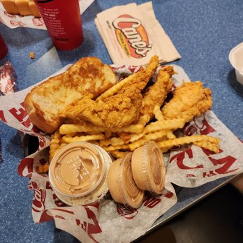Raising Cane's Chicken Fingers - a basket of fried chicken and french fries - Chicken Wings Near Me - Columbus, Ohio