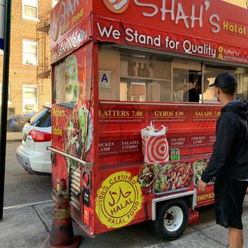Shah's Halal Food - a man standing in front of a food truck - Halal Near Me - Sunnyside, New York Shah's Halal Food - a man standing in front of a food truck - Halal Near Me - Sunnyside, New York
