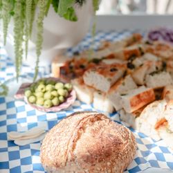 Oat Bakery - Seeded sourdough and sliced olive focaccia. This was for an event.