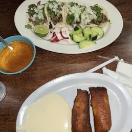 Tamale elote, beef tacos Tamale elote, beef tacos