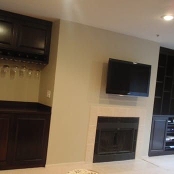 Altemueller Finish Carpentry - Two custom built-ins: bar with wine rack and entertainment center. - Carpenters Near Me Altemueller Finish Carpentry - Two custom built-ins: bar with wine rack and entertainment center. - Carpenters Near Me