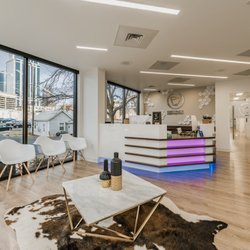 District Dentistry - Modern waiting room with coffee and soft drinks bar.