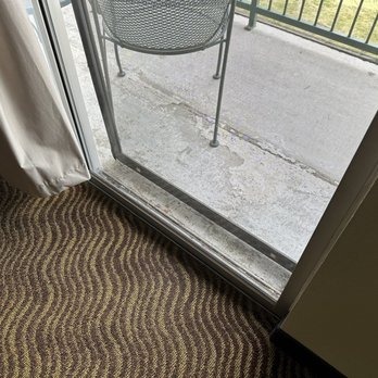 Quality Inn - Screen door on balcony hanging off of door - Hotels Near Me - Payson, Arizona