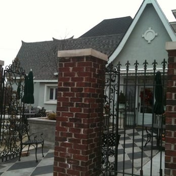 Courtyard On Main - brick pillars and gate - New American Near Me - McPherson, Kansas