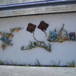 Rather interesting art work on the back (south) wall, outside.
