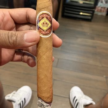 Cigar Store & Lounge By CDOT - a hand holding a cigar - Tobacco Shops Near Me - Houston, Texas Cigar Store & Lounge By CDOT - a hand holding a cigar - Tobacco Shops Near Me - Houston, Texas