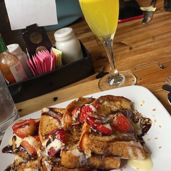 Seven Mile Cafe - Sweet stuffed French toast with an orange juice mimosa from the carafe! - Breakfast & Brunch Near Me - Keller, Texas