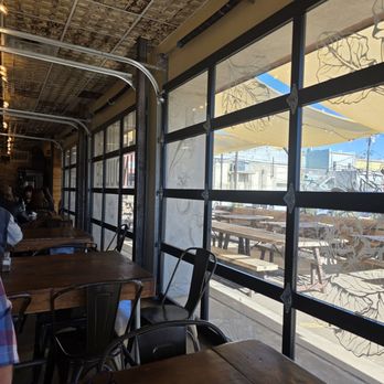 Lettuce Indulge - Glass garage doors all down the side. - Burgers Near Me - Denison, Texas