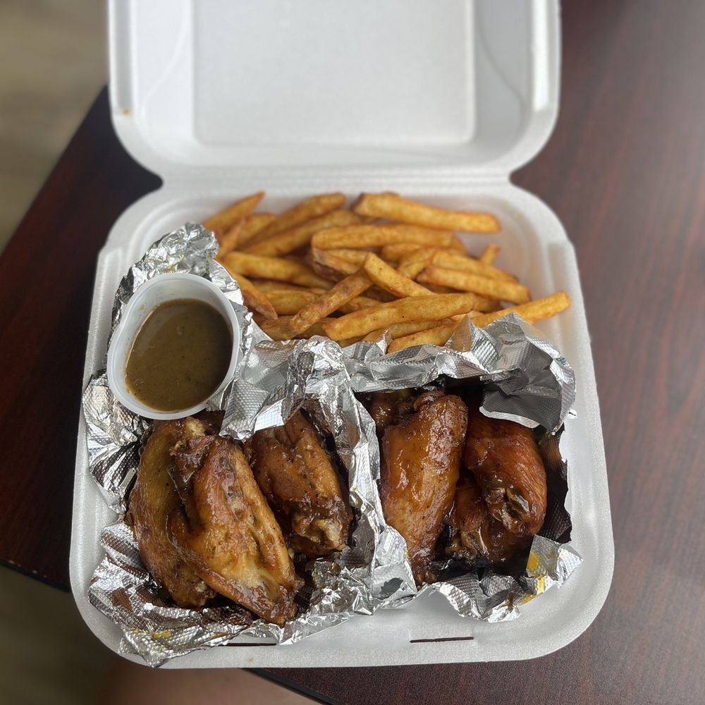 Midtown Cafe Daytona - chicken wings and french fries in a styrofoam container - Caribbean Near Me - Daytona Beach, Florida Midtown Cafe Daytona - chicken wings and french fries in a styrofoam container - Caribbean Near Me - Daytona Beach, Florida