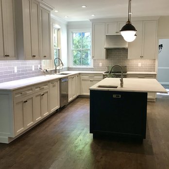 ESD Homes - a kitchen with white cabinets and wood floors - General Contractors Near Me - Atlanta, Georgia ESD Homes - a kitchen with white cabinets and wood floors - General Contractors Near Me - Atlanta, Georgia