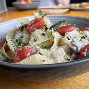 Damecca - a bowl of pasta with tomatoes and parmesan cheese - Asian Fusion Near Me - Winnipeg, Manitoba