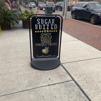 Sugar Buzzed - a sign on a sidewalk - Candy Stores Near Me - Wilmington, North Carolina Sugar Buzzed - a sign on a sidewalk - Candy Stores Near Me - Wilmington, North Carolina