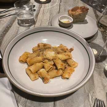 Tavernetta - Rigatoni with lamb Raghu and focaccia with garlic - Italian Near Me - Denver, Colorado Tavernetta - Rigatoni with lamb Raghu and focaccia with garlic - Italian Near Me - Denver, Colorado
