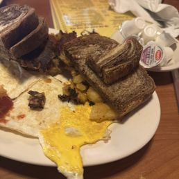 Cracked Eggs with home fries n Rye toast Cracked Eggs with home fries n Rye toast