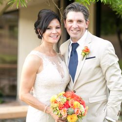 Tom Simmons Events - Lovey bride and handsome groom with fall flowers.