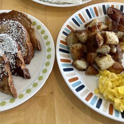 The Kitchen Table - French toast with fried potatoes, scrambled eggs, and bacon.