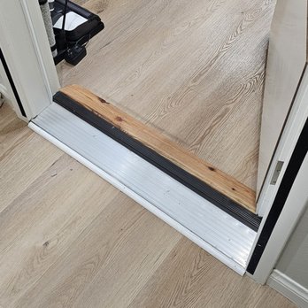 Ace Pro Builders - ACE PRO BUILDERS supposed to have the floor tiles extend thru the doorway. Instead placed this ugly industrial step to cover mistake. - General Contractors Near Me Ace Pro Builders - ACE PRO BUILDERS supposed to have the floor tiles extend thru the doorway. Instead placed this ugly industrial step to cover mistake. - General Contractors Near Me
