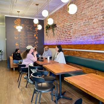 Rue Cafe - people sitting at tables in a cafe - Coffee & Tea Near Me - Washington, DC, District of Columbia