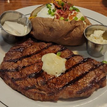 Saltgrass Steak House - 10oz ribeye(med), loaded potato, and a salad that didn't make it to my camera lens. Lol...I was hungry - Steakhouses Near Me - Irving, Texas Saltgrass Steak House - 10oz ribeye(med), loaded potato, and a salad that didn't make it to my camera lens. Lol...I was hungry - Steakhouses Near Me - Irving, Texas